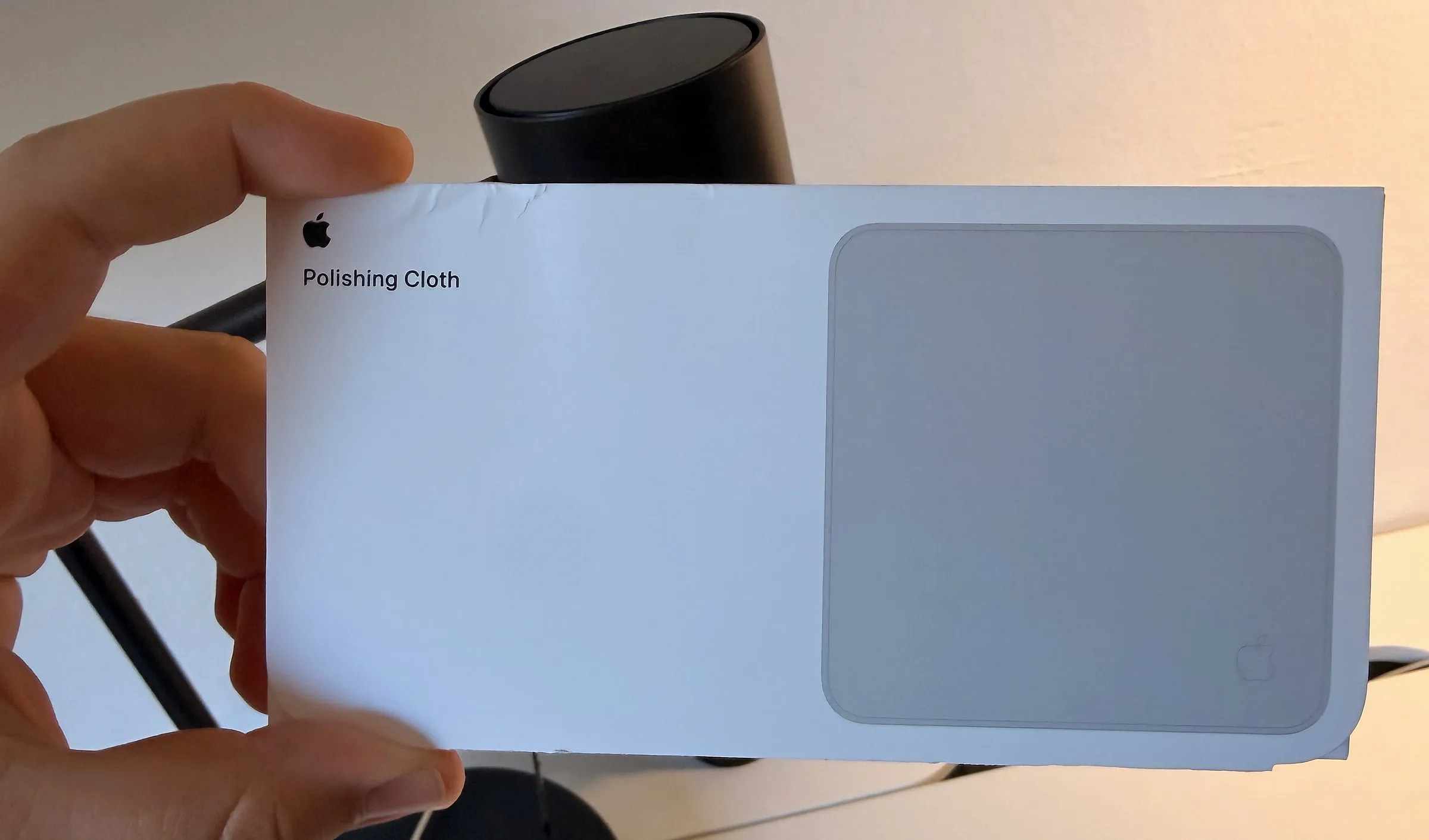 The new box on a desk, its front redrawn to match Apple's current packaging